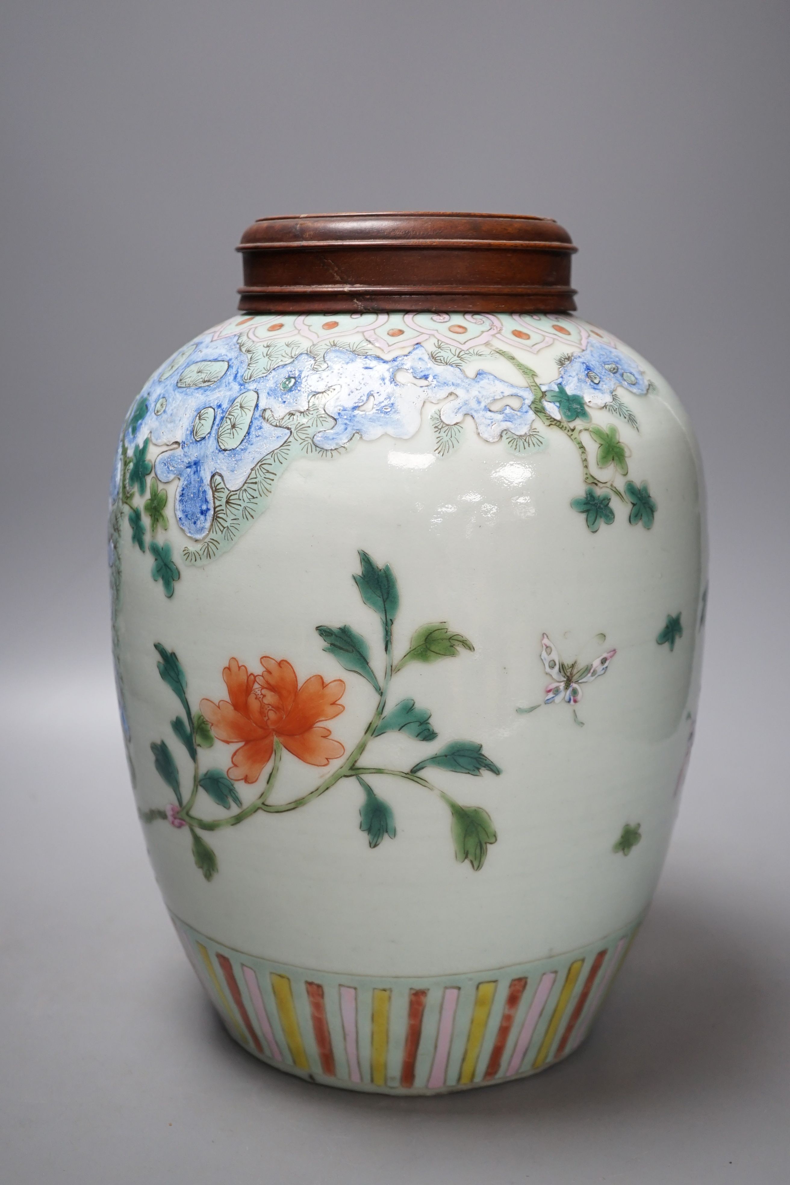 A Chinese Straits famille rose ‘phoenix’ jar and Hongmu cover, 30 cms high including cover.